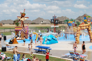 Image of water play equipment with sprayers and pirate ship themed water play features